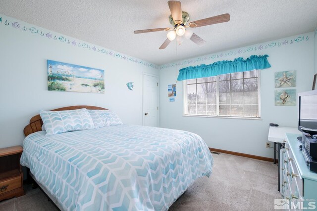930 Edgewater, Fallon, NV 89406 - bedroom featuring light carpet, a textured ceiling, baseboards, and ceiling fan