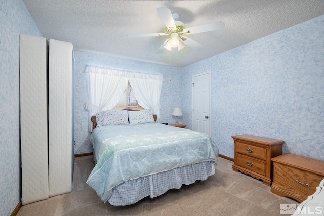 930 Edgewater, Fallon, NV 89406 - carpeted bedroom with a textured ceiling, baseboards, a ceiling fan, and wallpapered walls