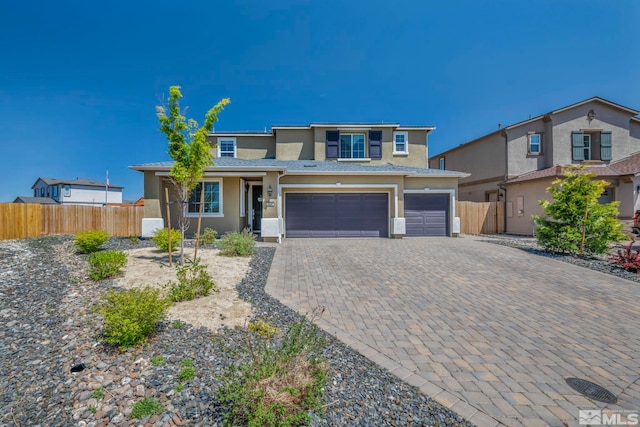 7836 Tarkio Ct, Sparks, NV 89436 - view of front of property with stucco siding, fence, an attached garage, and decorative driveway