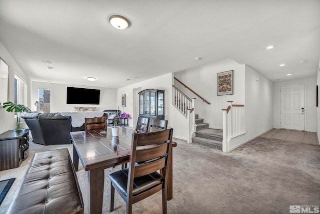 7836 Tarkio Ct, Sparks, NV 89436 - dining space featuring light carpet, stairs, plenty of natural light, and recessed lighting