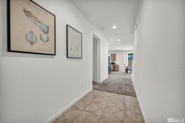 7836 Tarkio Ct, Sparks, NV 89436 - hallway featuring baseboards, recessed lighting, light carpet, and light tile patterned floors