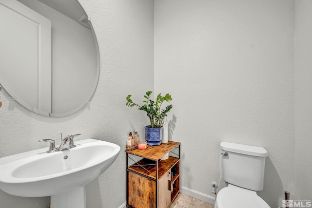 7836 Tarkio Ct, Sparks, NV 89436 - bathroom with a sink, toilet, and baseboards