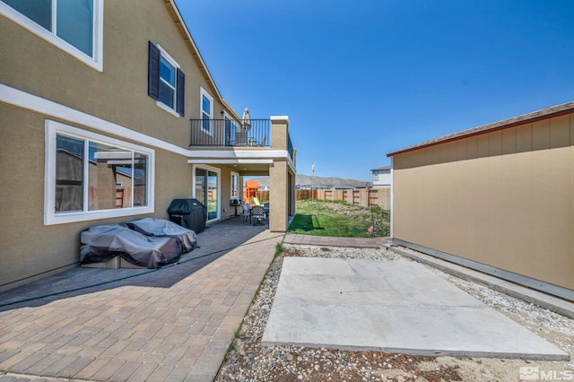 7836 Tarkio Ct, Sparks, NV 89436 - view of patio featuring a balcony, fence, and a grill