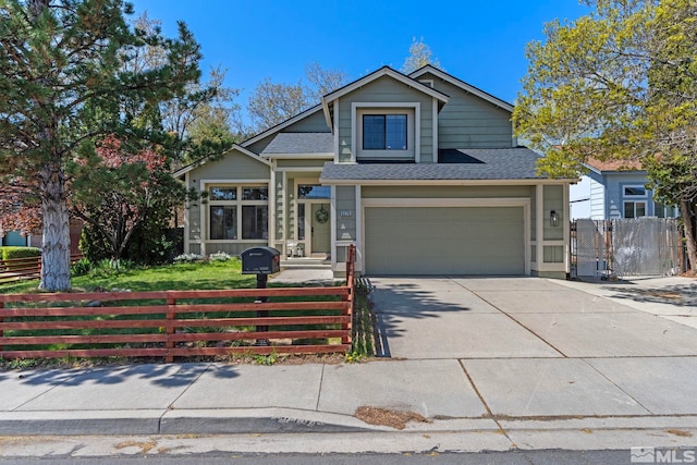 5276 Simons Dr, Reno, NV 89523 - view of front of home with a fenced front yard, concrete driveway, a garage, and roof with shingles