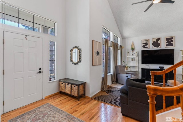 5276 Simons Dr, Reno, NV 89523 - foyer featuring light wood-type flooring, plenty of natural light, high vaulted ceiling, and a ceiling fan