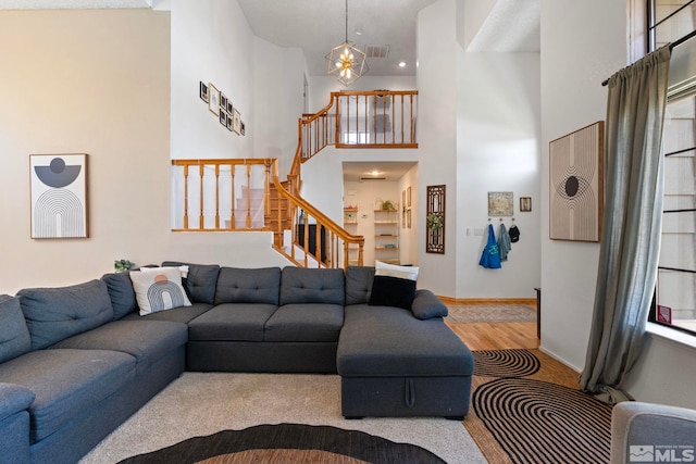 5276 Simons Dr, Reno, NV 89523 - living room featuring stairs, wood finished floors, and a high ceiling