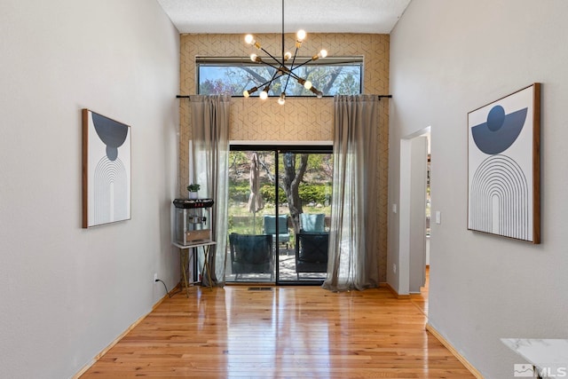 5276 Simons Dr, Reno, NV 89523 - foyer entrance with a chandelier and wood finished floors