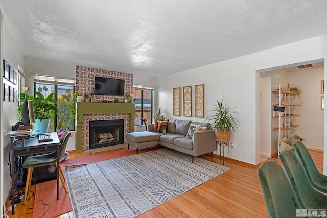 5276 Simons Dr, Reno, NV 89523 - living room with a brick fireplace and wood finished floors