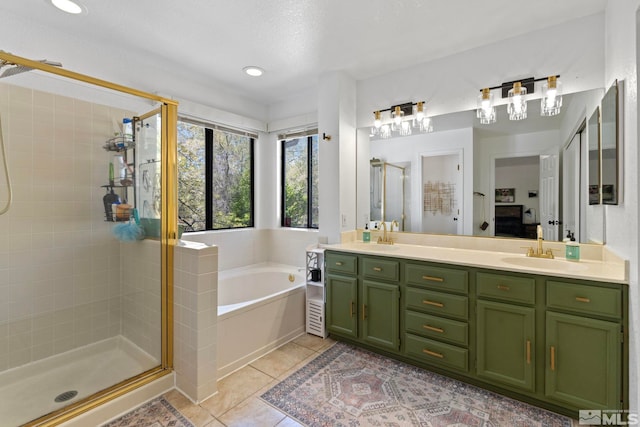 5276 Simons Dr, Reno, NV 89523 - bathroom with a stall shower, a bath, double vanity, tile patterned floors, and recessed lighting