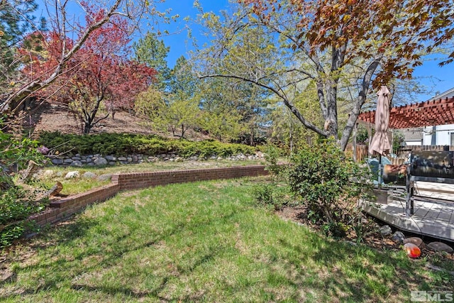 5276 Simons Dr, Reno, NV 89523 - view of green lawn with a pergola and a wooden deck