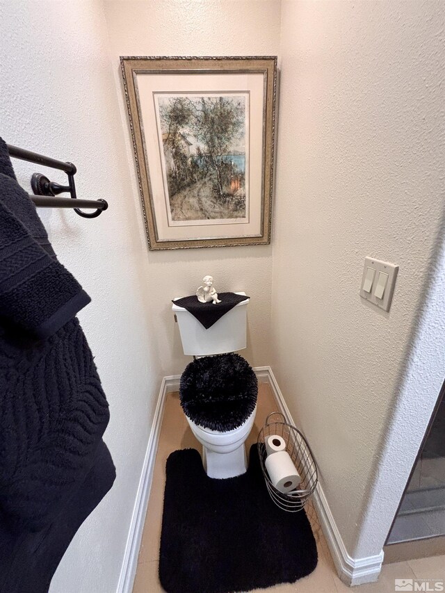 900 S Meadows Pkwy Apt 5021, Reno, NV 89521 - bathroom featuring baseboards, tile patterned flooring, and toilet