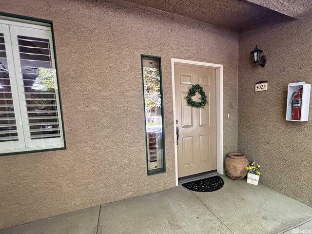 900 S Meadows Pkwy Apt 5021, Reno, NV 89521 - doorway to property featuring stucco siding