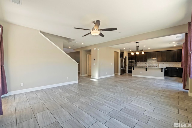 1680 Verdi Vista Ct, Reno, NV 89523 - unfurnished living room featuring a ceiling fan, recessed lighting, and a chandelier