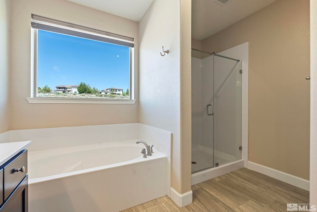 1680 Verdi Vista Ct, Reno, NV 89523 - full bath with a garden tub, wood finished floors, a shower stall, and vanity