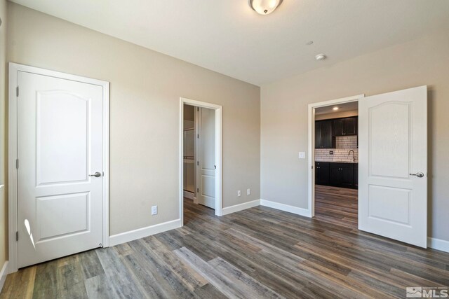 1680 Verdi Vista Ct, Reno, NV 89523 - unfurnished bedroom with dark wood-type flooring and ensuite bath