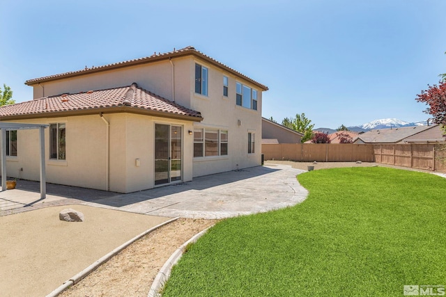 10655 Birch Point Ct, Reno, NV 89521 - back of house with a tiled roof, a patio, and stucco siding