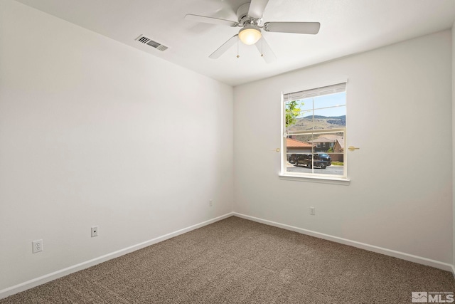 10655 Birch Point Ct, Reno, NV 89521 - spare room featuring carpet floors, a ceiling fan, and baseboards