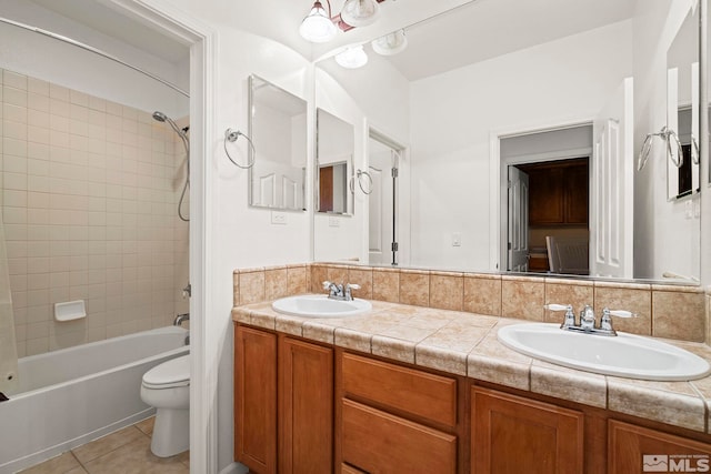 10655 Birch Point Ct, Reno, NV 89521 - full bathroom featuring toilet, double vanity, tub / shower combination, and tile patterned floors