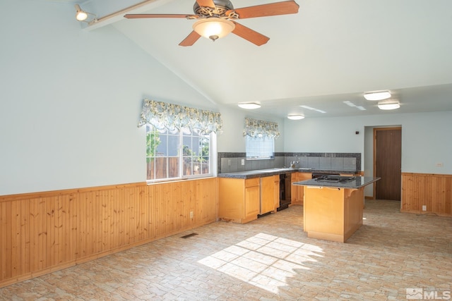 830 Lepori Way, Sparks, NV 89431 - kitchen featuring wainscoting, beamed ceiling, wooden walls, dark countertops, and ceiling fan