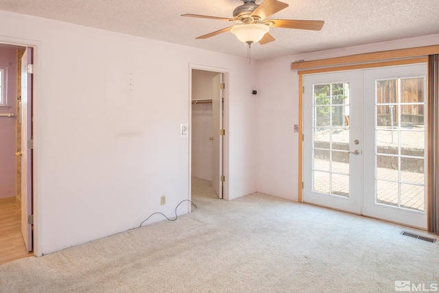 830 Lepori Way, Sparks, NV 89431 - empty room with french doors, carpet, ceiling fan, and a textured ceiling