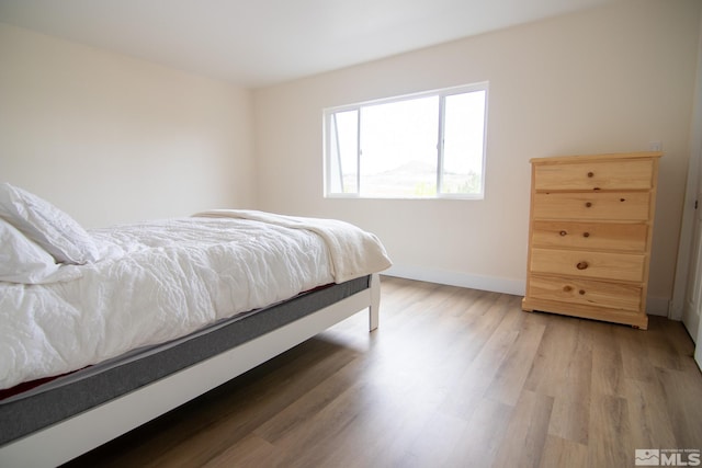 100 Bisset Ct Unit B, Reno, NV 89503 - bedroom featuring light wood-style flooring and baseboards