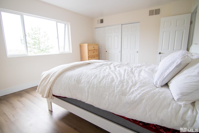 100 Bisset Ct Unit B, Reno, NV 89503 - bedroom featuring wood finished floors, baseboards, and a closet