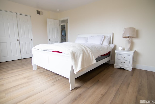 100 Bisset Ct Unit B, Reno, NV 89503 - bedroom featuring light wood-type flooring, a closet, and baseboards