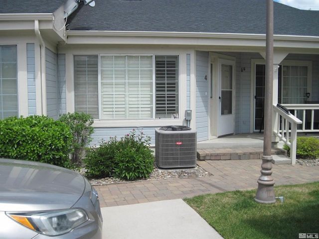 1420 N Douglas Unit 4, Gardnerville, NV 89410 - entrance to property featuring central air condition unit and a shingled roof
