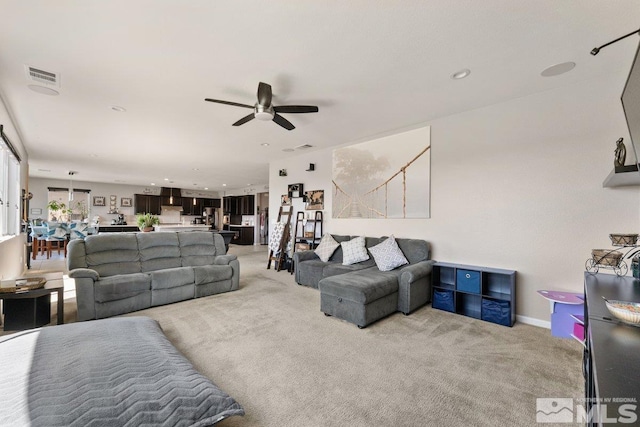 2449 Butte Creek Dr, Sparks, NV 89436 - living area featuring ceiling fan, light colored carpet, baseboards, and recessed lighting