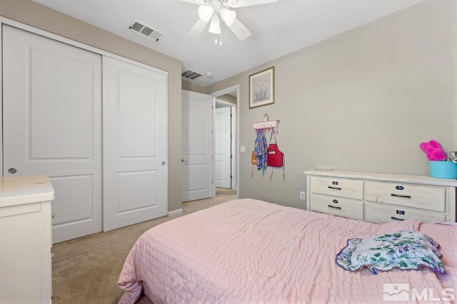 2449 Butte Creek Dr, Sparks, NV 89436 - bedroom featuring light carpet, a closet, and ceiling fan