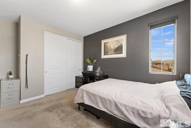2449 Butte Creek Dr, Sparks, NV 89436 - bedroom featuring carpet floors, a closet, and baseboards
