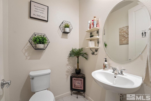 2449 Butte Creek Dr, Sparks, NV 89436 - bathroom featuring a sink, toilet, and tile patterned flooring