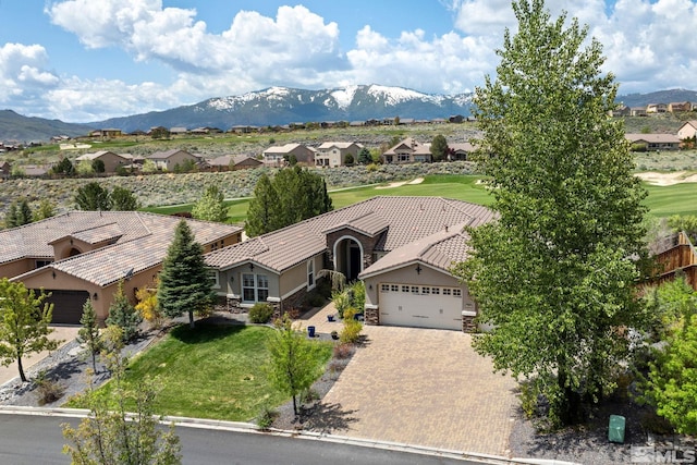 aerial perspective of suburban area with mountains and a golf course