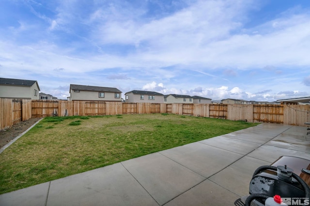 8853 Finnsech, Reno, NV 89506 - fenced backyard featuring a patio and a residential view