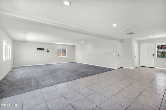 8853 Finnsech, Reno, NV 89506 - unfurnished room featuring carpet, recessed lighting, healthy amount of natural light, and tile patterned flooring