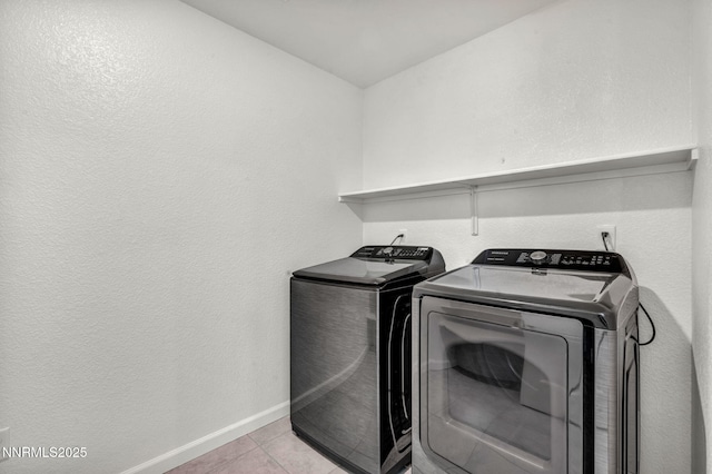 8853 Finnsech, Reno, NV 89506 - washroom with washing machine and clothes dryer and tile patterned floors