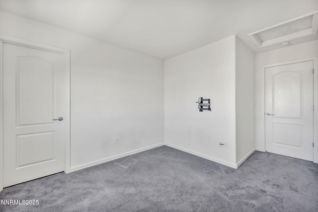 8853 Finnsech, Reno, NV 89506 - carpeted spare room featuring baseboards and attic access