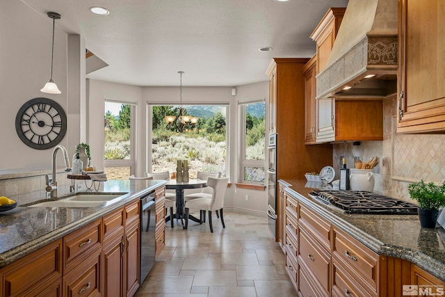 202 Paddington Ct, Reno, NV 89511 - kitchen with a sink, custom range hood, gas stovetop, dishwasher, and brown cabinetry