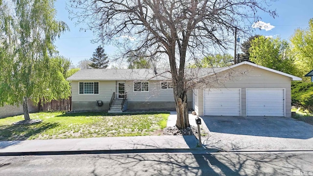 single story home with driveway and a garage
