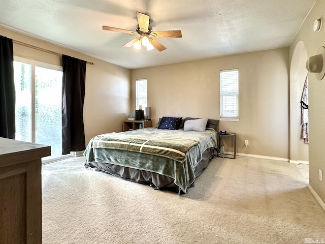 bedroom featuring carpet, baseboards, and ceiling fan