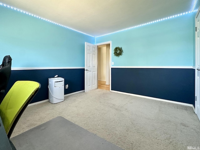 unfurnished office with carpet and baseboards