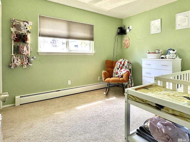 bedroom with a baseboard radiator, carpet floors, and baseboards