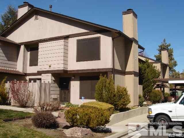 4550 Matich Dr, Reno, NV 89502 - back of house with a chimney and stucco siding
