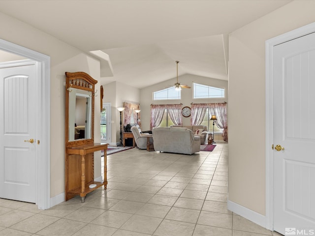 137 Desert Lakes Dr, Fernley, NV 89408 - corridor featuring light tile patterned flooring, vaulted ceiling, and baseboards