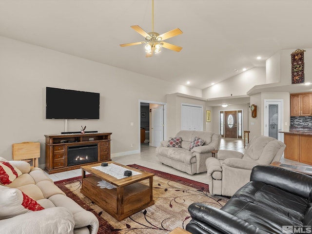 137 Desert Lakes Dr, Fernley, NV 89408 - living area with baseboards, vaulted ceiling, recessed lighting, ceiling fan, and a glass covered fireplace