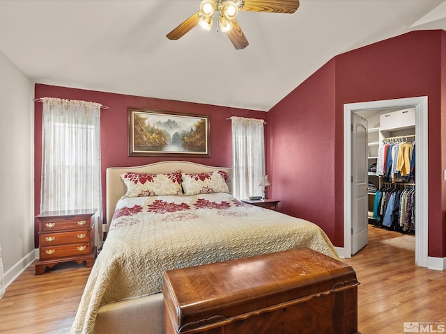 137 Desert Lakes Dr, Fernley, NV 89408 - bedroom featuring lofted ceiling, a spacious closet, light wood-type flooring, baseboards, and ceiling fan