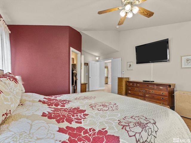 137 Desert Lakes Dr, Fernley, NV 89408 - bedroom with wood finished floors, a spacious closet, a ceiling fan, and vaulted ceiling