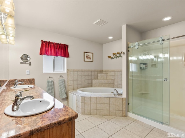 137 Desert Lakes Dr, Fernley, NV 89408 - bathroom with tile patterned floors, a garden tub, a stall shower, double vanity, and recessed lighting