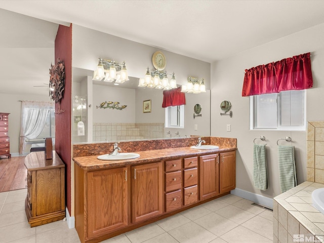 137 Desert Lakes Dr, Fernley, NV 89408 - bathroom featuring tile patterned floors, a relaxing tiled tub, and double vanity