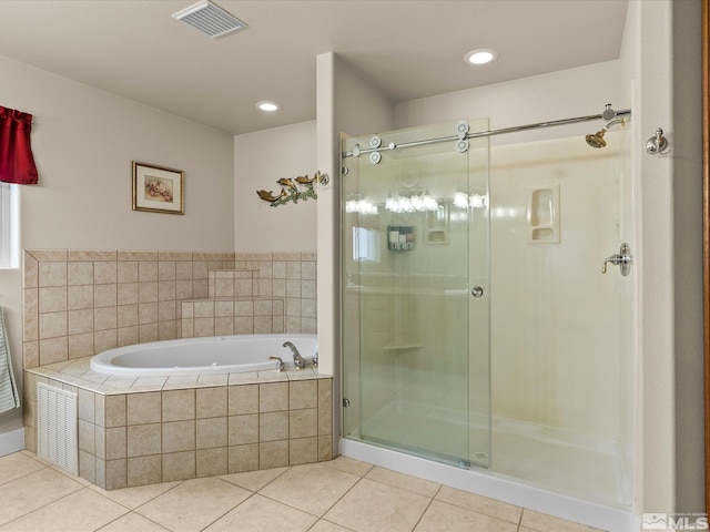 137 Desert Lakes Dr, Fernley, NV 89408 - full bathroom featuring tile patterned floors, a garden tub, a shower stall, and recessed lighting